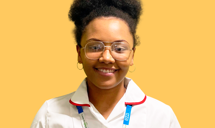 University student Tanisha, 18, smiles for the camera whilst wearing her nursing uniform
