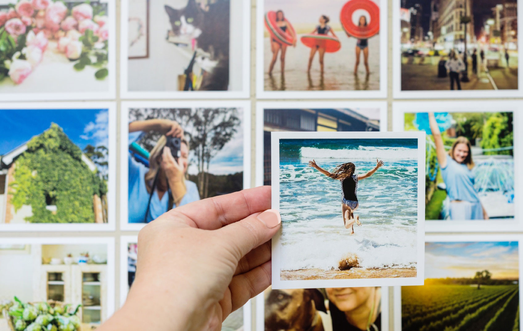 A collage of polaroid pictures on a wall